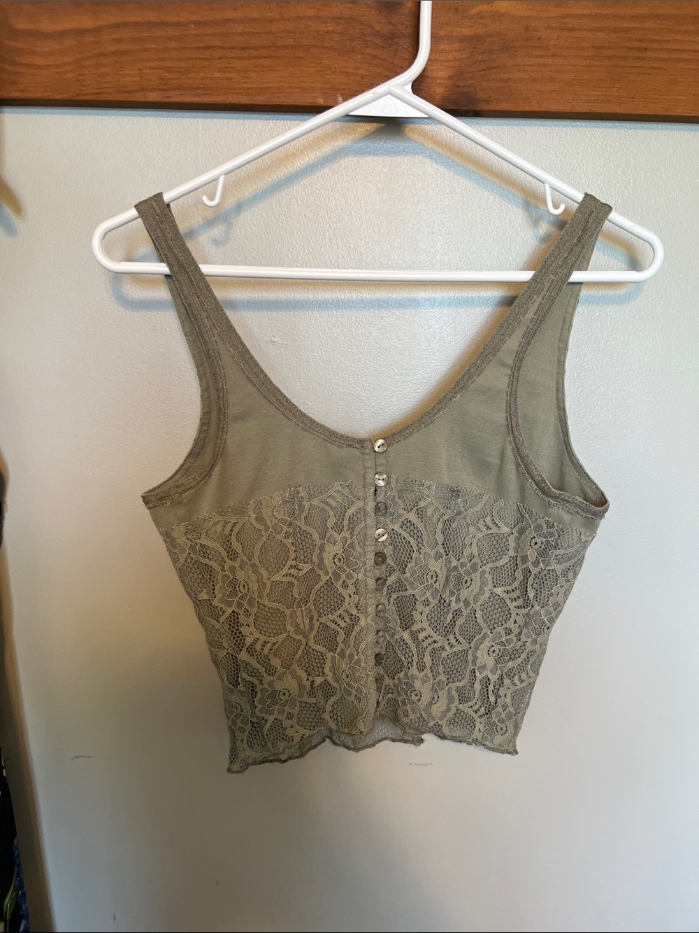Free People Lace crop top with button accents.